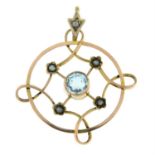 An early 20th century gold aquamarine and split pearl pendant.