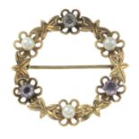 A mid 20th century 9ct gold amethyst and seed pearl wreath brooch.