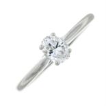 A platinum oval-cut diamond single-stone ring.