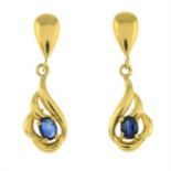 A pair of sapphire drop earrings.