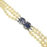 A cultured pearl three-row necklace, with sapphire and single-cut diamond clasp.