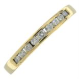 An 18ct gold brilliant-cut diamond half eternity ring.