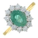 An emerald and brilliant-cut diamond cluster ring.