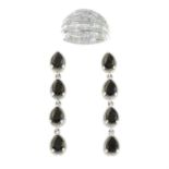 A vari-cut diamond ring, and a pair of onyx drop earrings.