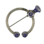 A late 19th century silver and blue enamel pin brooch.