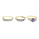 Three diamond, cubic zirconia and amethyst rings.