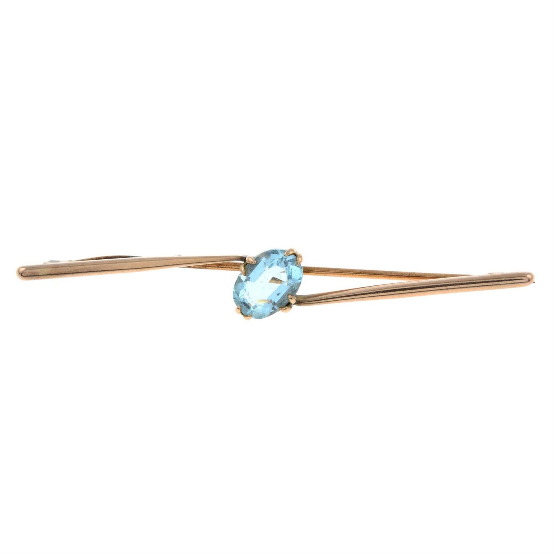 An early 20th century 9ct gold blue paste bar brooch.