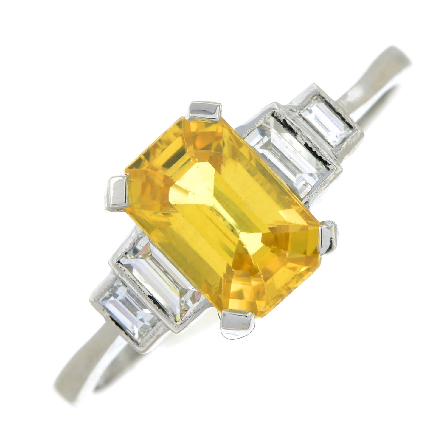 A yellow sapphire and baguette-cut diamond ring.