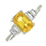A yellow sapphire and baguette-cut diamond ring.