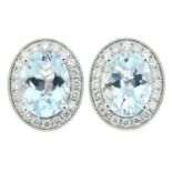 A pair of 18ct gold aquamarine and diamond cluster stud earrings.