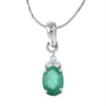 An emerald and diamond pendant, suspended from a chain.