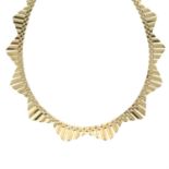 A 1950s 9ct gold collar necklace, by John Grinsell & Sons.
