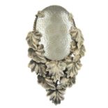 An early 20th century silver frosted glass leaf dress clip.