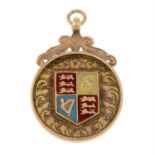 A 9ct gold and enamel shield pendant.