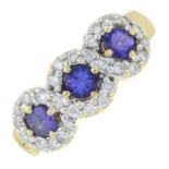 A tanzanite and brilliant-cut diamond three cluster ring.