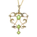 An early 20th century 9ct gold peridot and pearl pendant, suspended from later chain.