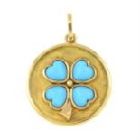 A reconstituted turquoise pendant of a shamrock.