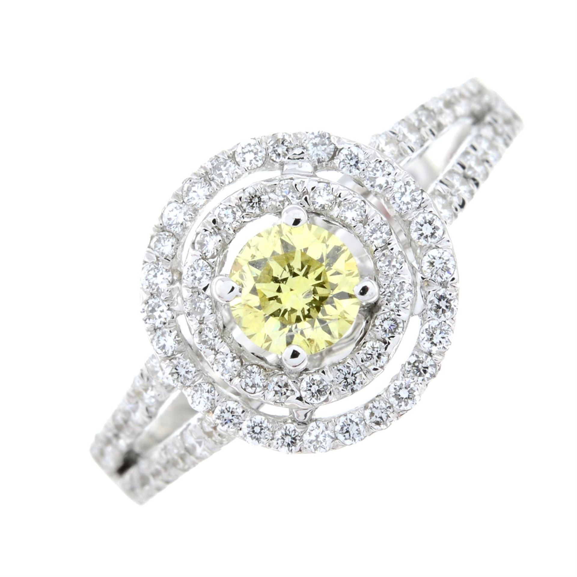 A colour-treated 'yellow' brilliant-cut diamond and diamond cluster ring.