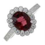 An 18ct gold pink tourmaline and brilliant-cut diamond cluster ring.