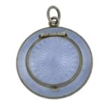 An early 20th century silver and enamel compact pendant, with guilloche motif.