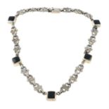 A black enamel fancy-link necklace.