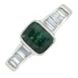 An 18ct gold emerald ring, with calibre-cut diamond shoulders.