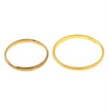 Two gold band rings.