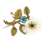 An 1830s ivory and turquoise floral spray brooch.