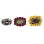 Three gem-set brooches.