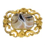 A banded agate brooch, with cannetille surround.