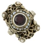 A garnet and seed pearl dress ring.