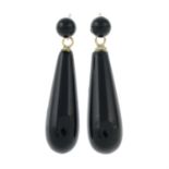 A pair of onyx drop earrings.