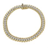 A 9ct gold diamond bracelet.