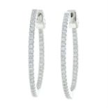 A pair of 18ct gold diamond hoop earrings.