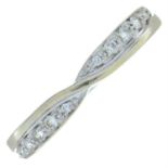 A 9ct gold brilliant-cut diamond crossover ring.