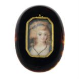 An early 19th century portrait miniature pendant, painted to depict a young lady,