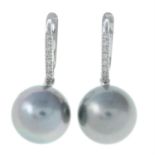 A pair of cultured pearl and diamond drop earrings.