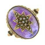 A 9ct gold amethyst cabochon and split pearl ring, with a star motif.