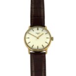 A circular dial, brown strap with crocodile style strap wrist watch by, Longines.