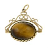 A 9ct gold tigers eye and onyx swivel fob.