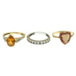 Three gem-set rings.