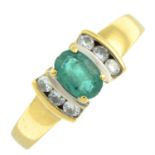 An 18ct emerald and diamond ring.