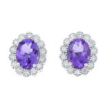 A pair of 18ct gold amethyst and brilliant-cut diamond cluster earrings.