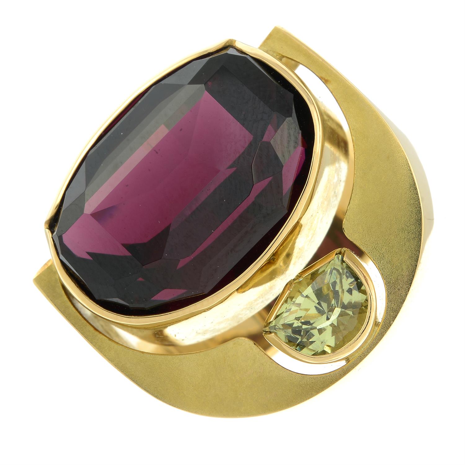 An 18ct gold red and green garnet dress ring, by Erwin Springbrunn.