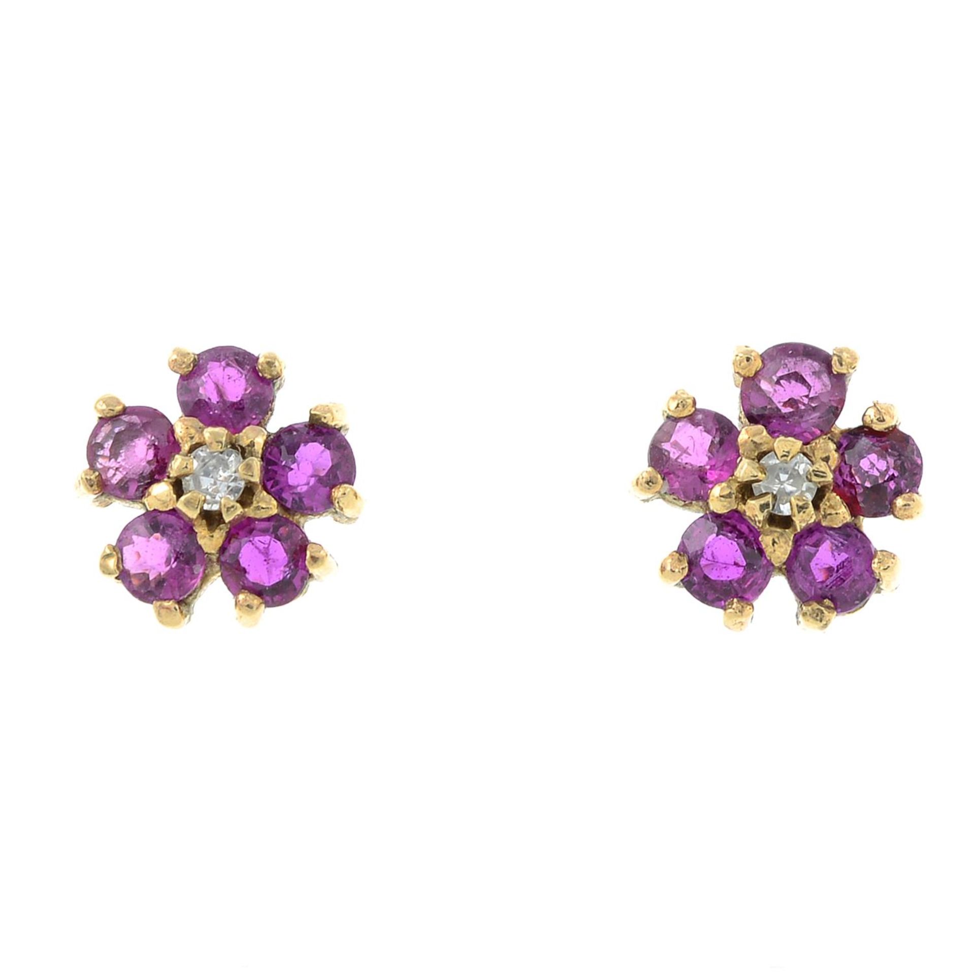 A pair of 9ct gold ruby and diamond cluster earrings.