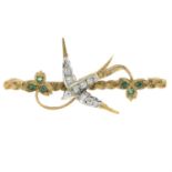 A 9ct gold emerald and cubic zirconia swallow brooch.