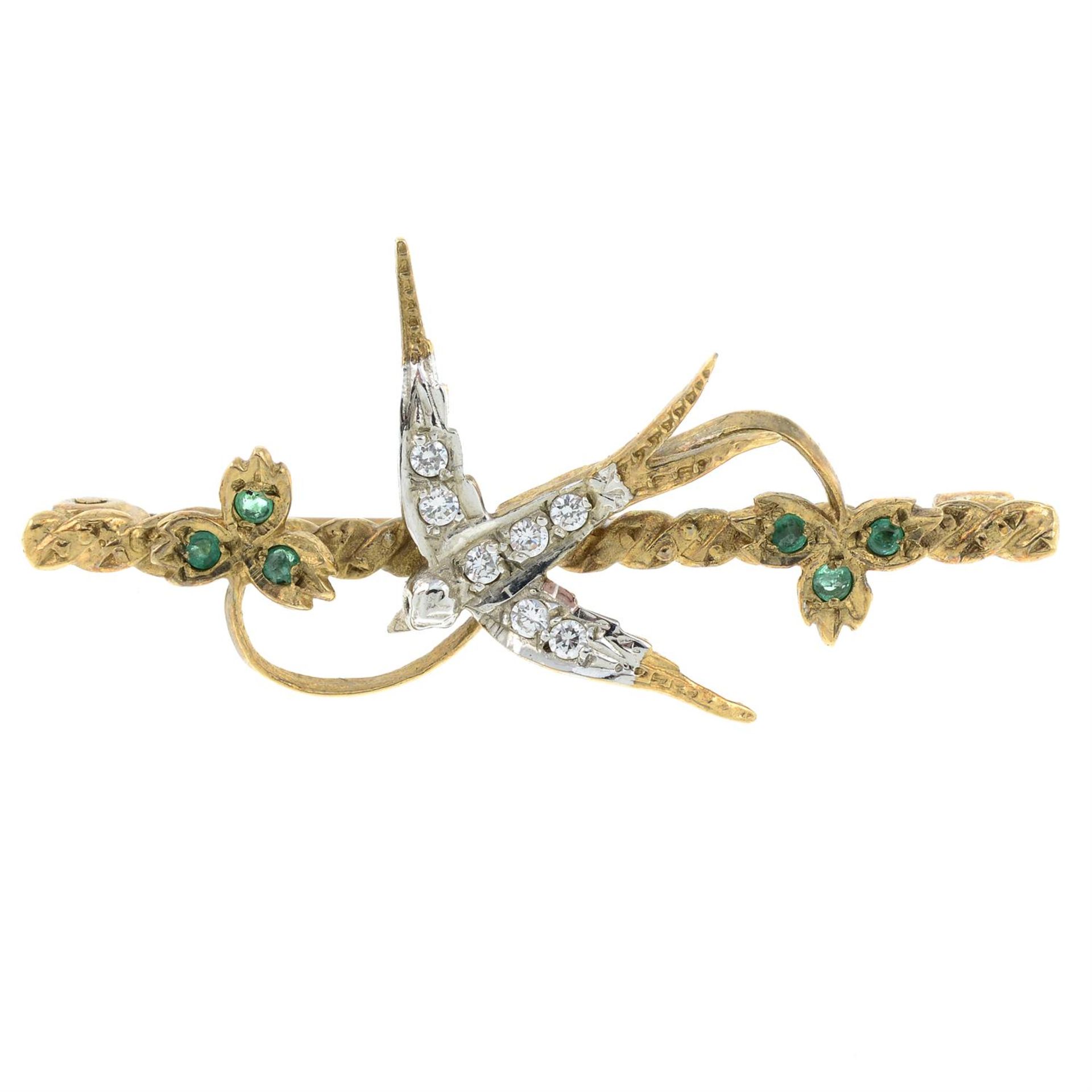 A 9ct gold emerald and cubic zirconia swallow brooch.