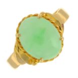 A jade cabochon single-stone ring.