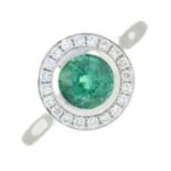 An emerald and brilliant-cut diamond cluster ring.