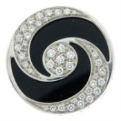 An onyx and pavé-set diamond 'Optical Illusion' spinner ring, by Bulgari.